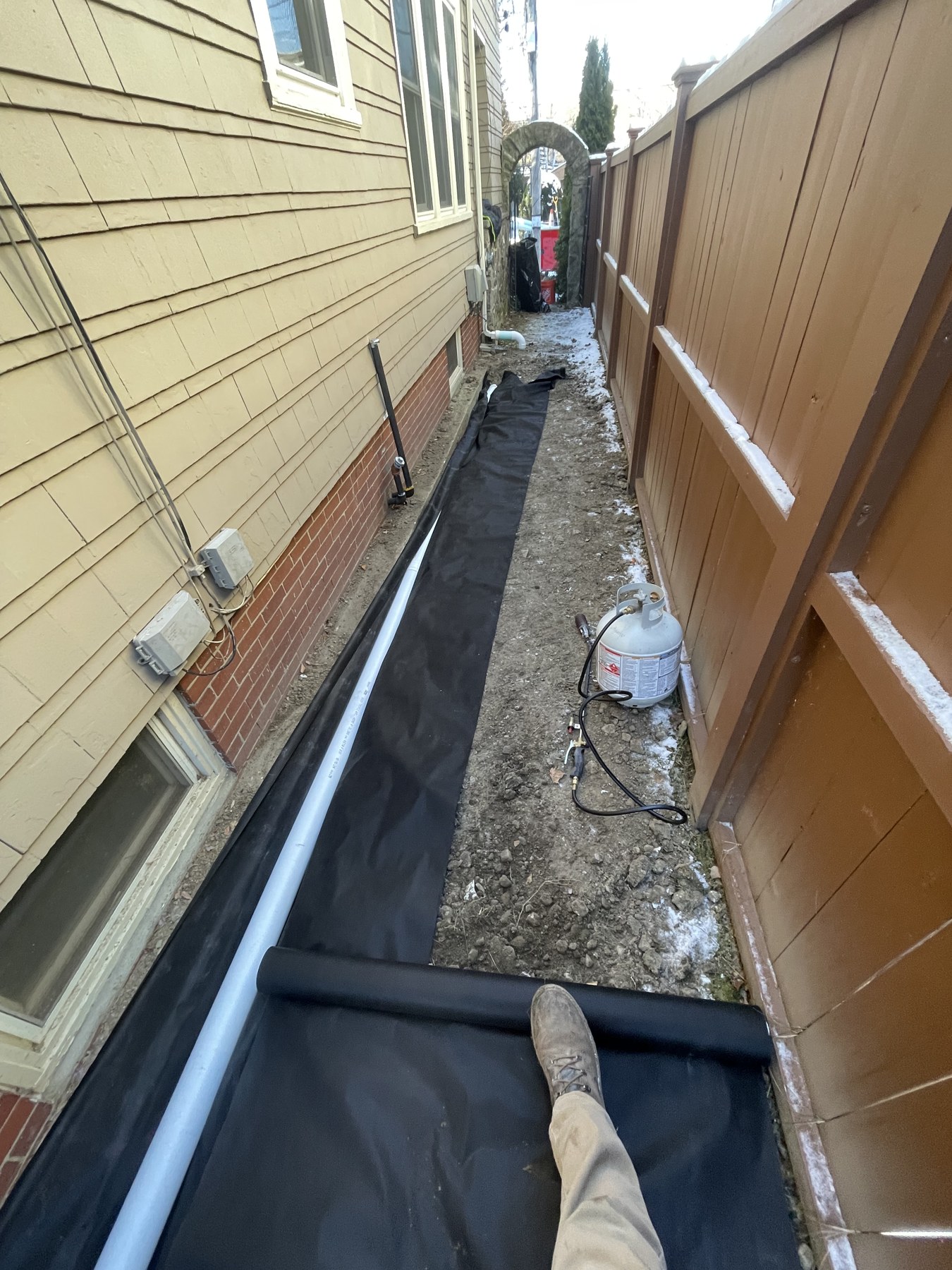 Drainage in a narrow side yard by Blue Line